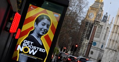 A public health advertisement encouraging people to get a booster vaccination is seen near Big Ben and the Houses of Parliament, in London, U.K., Dec. 29, 2021. (Reuters Photo)