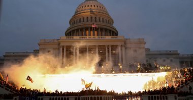An explosion caused by police munition is seen while supporters of then U.S. President Donald Trump gather in front of the U.S. Capitol Building in Washington, D.C., U.S., Jan. 6, 2021. (Reuters Photo)