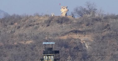 Military guard posts of North Korea, rear, and South Korea, front, are seen in Paju, near the border with North Korea, South Korea, Jan. 2, 2022. (AP Photo)