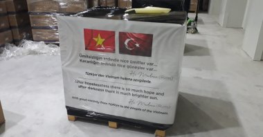 A view of aid packages adorned with Turkish and Vietnamese flags and with a quote of famed Sufi mystic Rumi, at the airport, in Istanbul, Turkey, Jan. 2, 2022. (AA PHOTO)