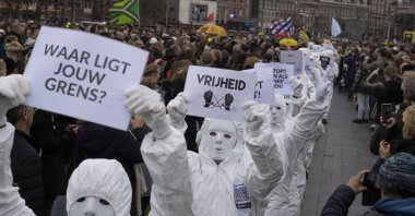 A sign reads &quot;Vrijheid&quot; or &quot;Freedom&quot; as thousands of people defied a ban to gather and protest the Dutch government&#039;s coronavirus lockdown measures, in Amsterdam, Netherlands, Jan. 2, 2022. (AP Photo)