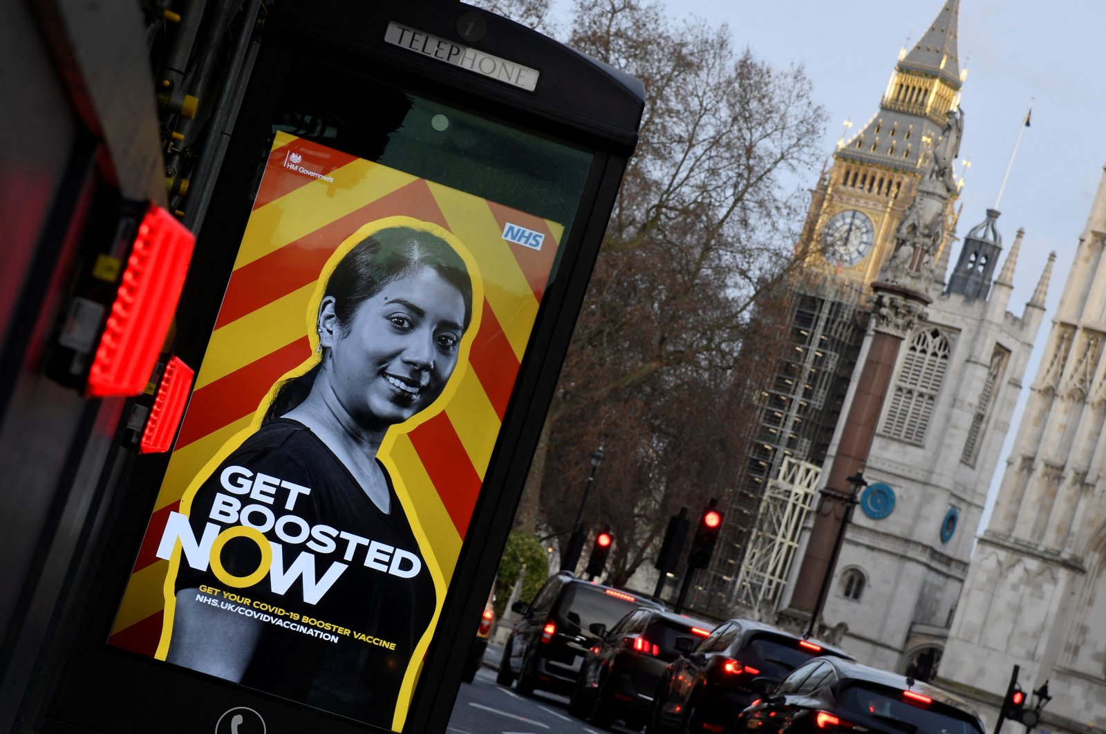 A public health advertisement encouraging people to get a booster vaccination is seen near Big Ben and the Houses of Parliament, in London, U.K., Dec. 29, 2021. (Reuters Photo)