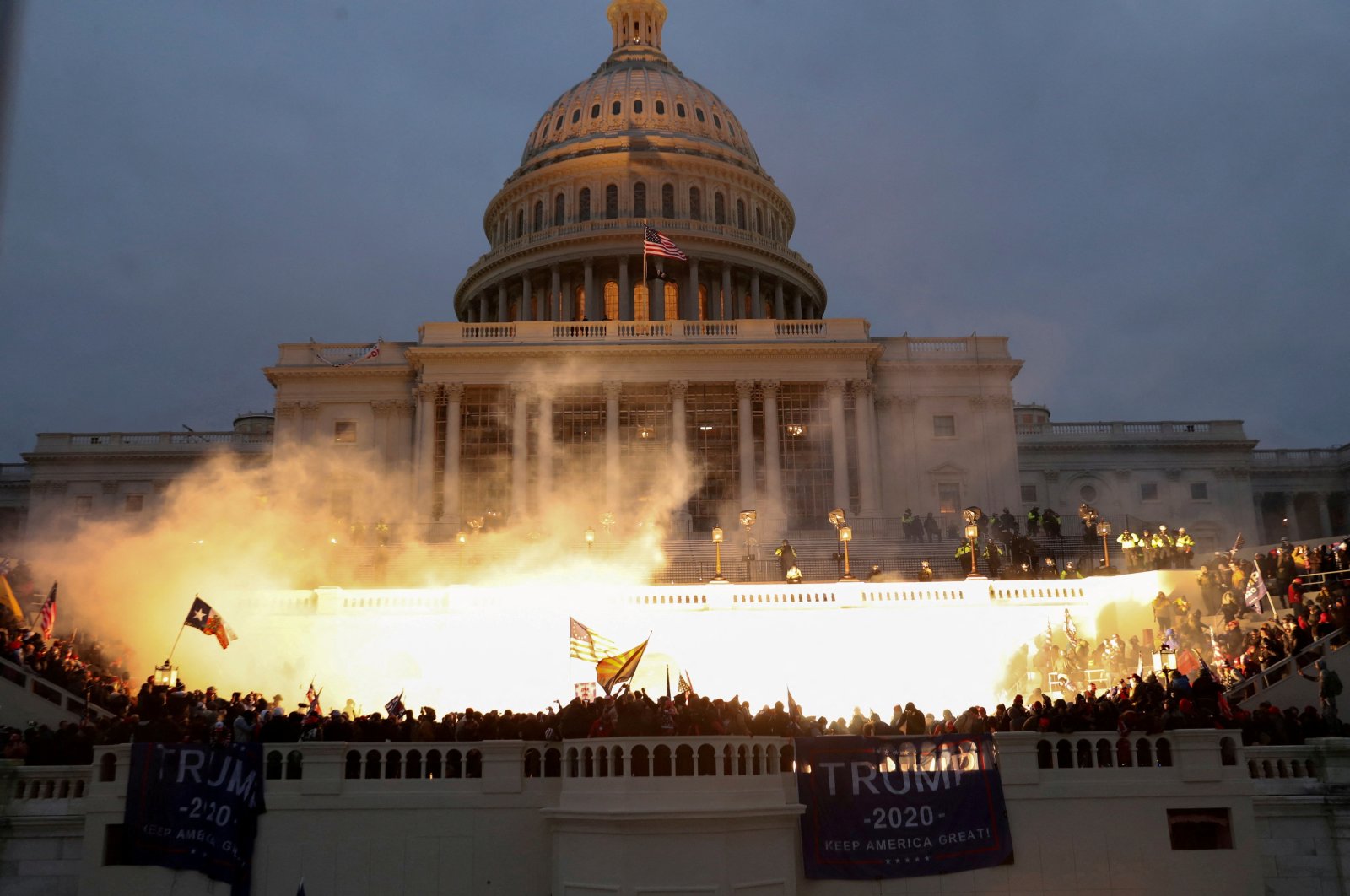 An explosion caused by police munition is seen while supporters of then U.S. President Donald Trump gather in front of the U.S. Capitol Building in Washington, D.C., U.S., Jan. 6, 2021. (Reuters Photo)