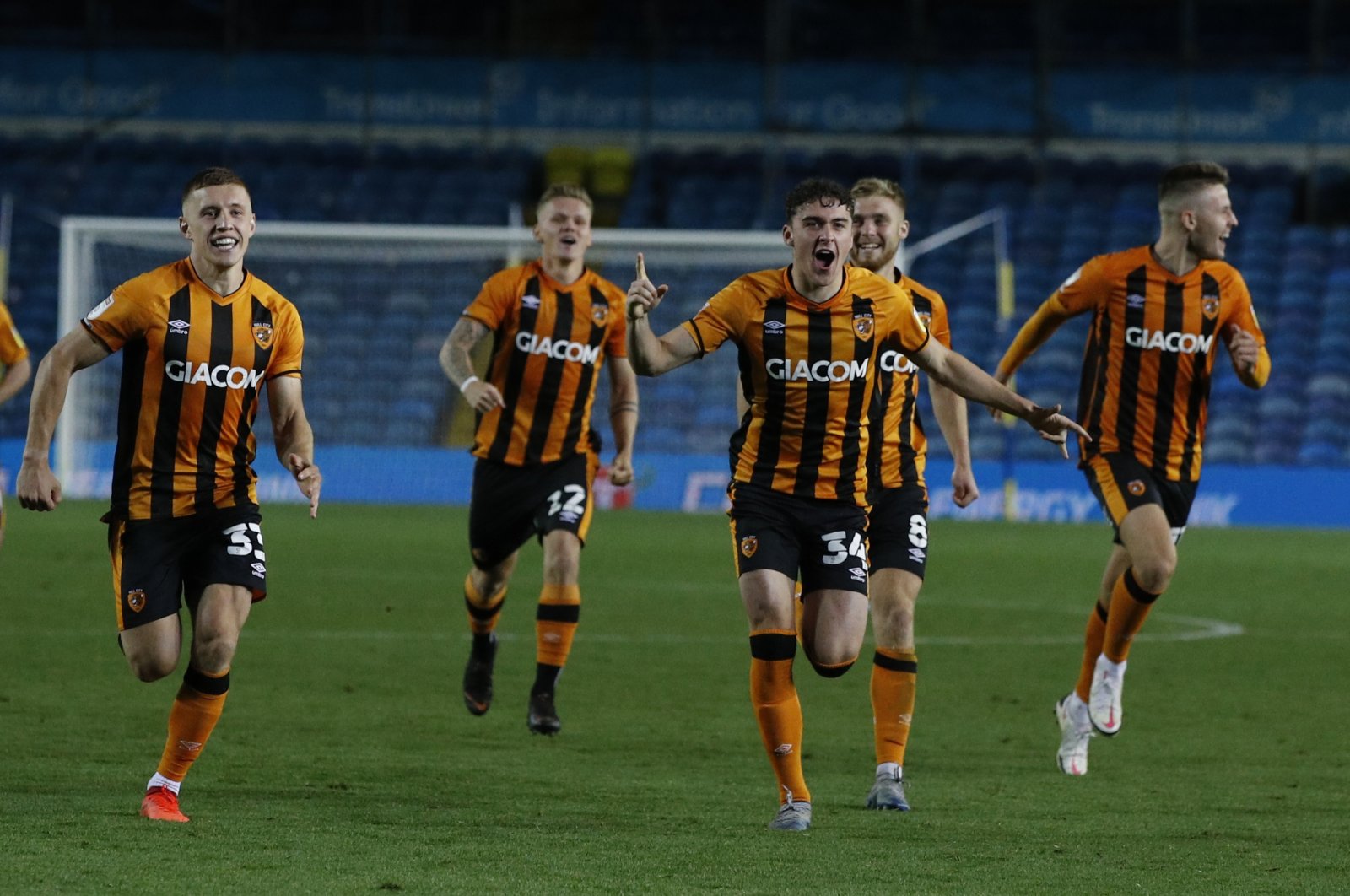 Hull City players run to celebrate after their winning penalty following the penalty shootout during an English League Cup match against Leeds United, Leeds, England, Sept. 16, 2020. (AP Photo)