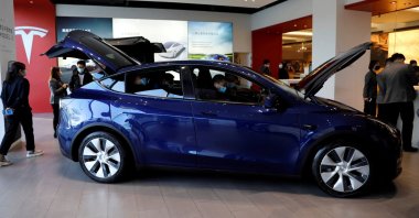 Visitors check a Tesla Model Y sport utility vehicle (SUV) at the company's showroom in Beijing, China, Jan. 5, 2021. (Reuters Photo)