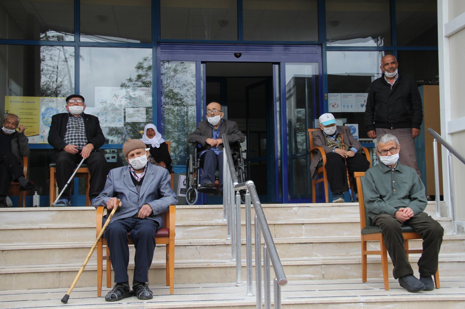 Elderly citizens sit in front of a nursing home in Karabük, northern Turkey, April 27, 2020. (İHA PHOTO)