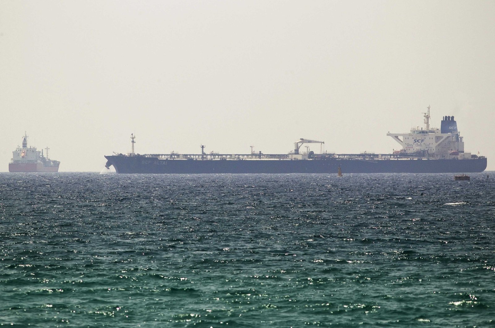 The SCF Altai tanker (R) docks near Israel&#039;s Ashkelon port, June 20, 2014. (Reuters Photo)