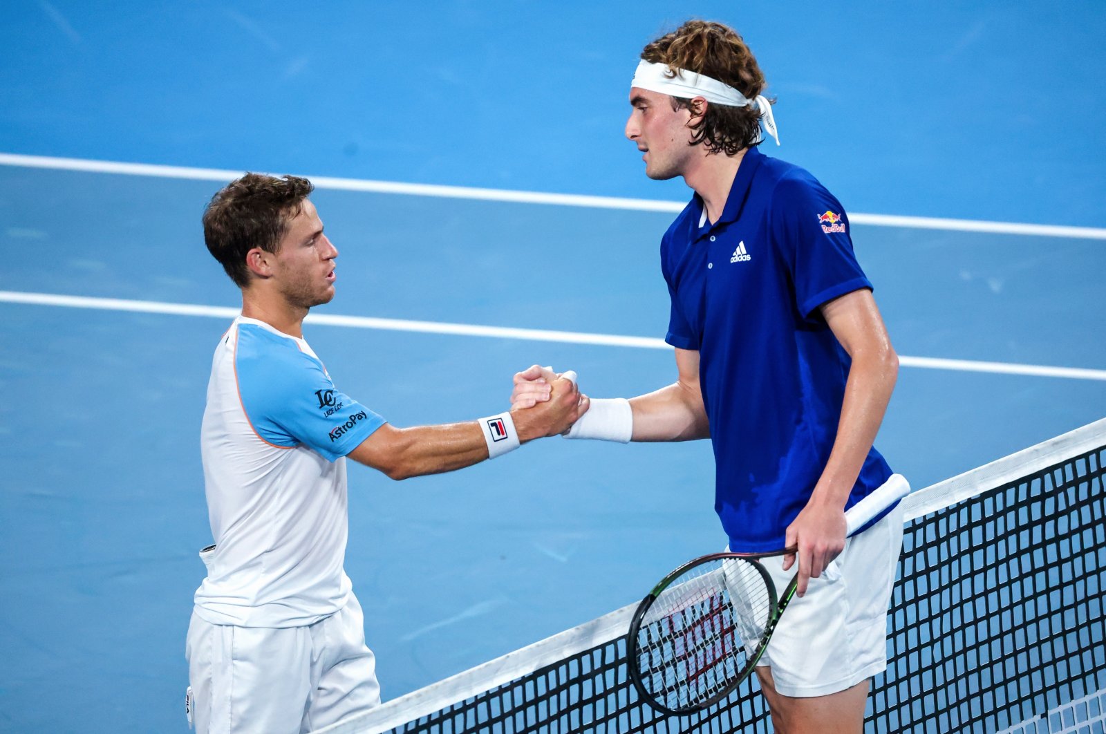 Argentina&#039;s Diego Schwartzman (L) shakes hands with Greece&#039;s Stefanos Tsitsipas after their match on Day 3 of the ATP Cup, Sydney, Australia, Jan. 3, 2022. (EPA Photo)