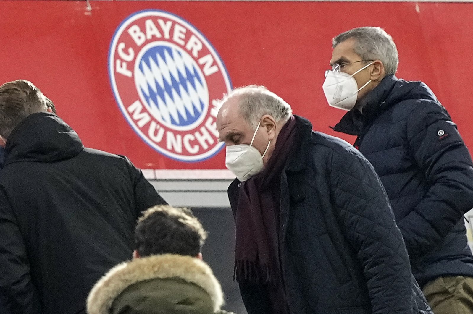 Former Bayern Munich President Uli Hoeness (C) leaves his place with a face mask during a Bundesliga match against Arminia Bielefeld, Munich, Germany, Nov. 27, 2021. (AP Photo)