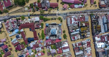 This aerial picture shows inundated buildings including a mosque (C) during flooding in Lhoksukon, North Aceh, Indonesia, Jan. 4, 2022. (AFP Photo)