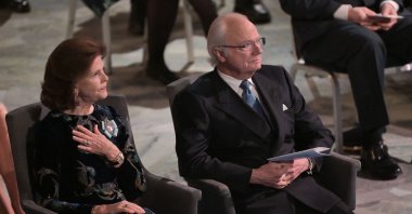 Sweden's King Carl XVI Gustaf and Queen Silvia attend a ceremony to pay tribute to the 2021 Nobel Prize laureates at the Stockholm City Hall in Stockholm, Sweden, Dec. 10, 2021. (AFP Photo)