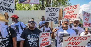 A group of activists demands justice for former Haitian President Jovenel Moise, as Martine Moise is interviewed as a witness by the judge investigating his assassination in Port-au-Prince, Haiti, Oct. 6, 2021. (AFP Photo)