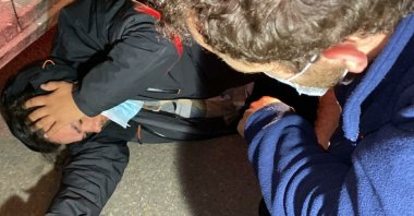 The Anadolu Agency cameraman holding his head after he was attacked by far-right extremist Israelis in the country's capital Tel Aviv, Jan. 5, 2022. (AA Photo)