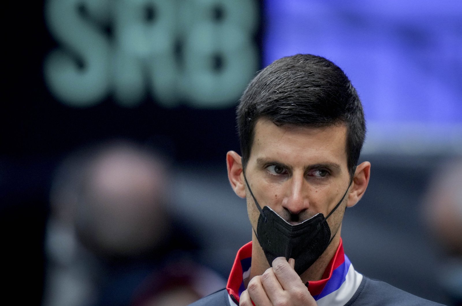 Serbia&#039;s Novak Djokovic wears a face mask prior to a Davis Cup match against Austria in Innsbruck, Austria, Nov. 26, 2021. (AP Photo)