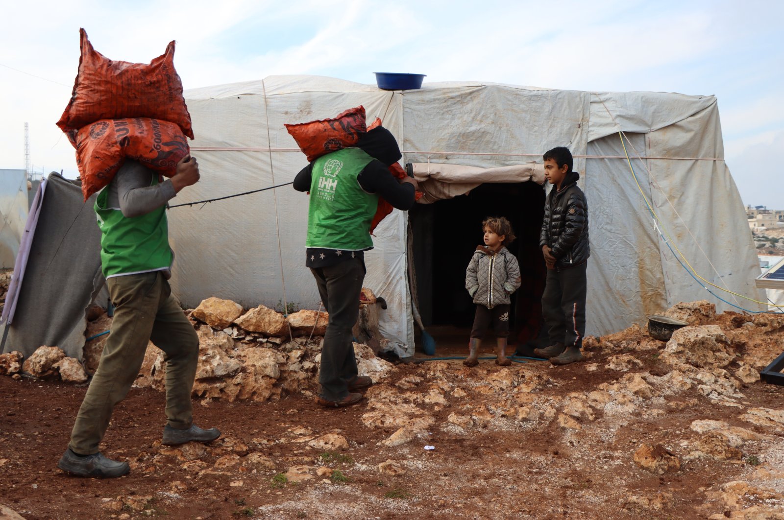 IHH volunteers carry aid to the needy in Syria in this photo released on Wednesday, Jan. 5, 2022. (AA Photo)