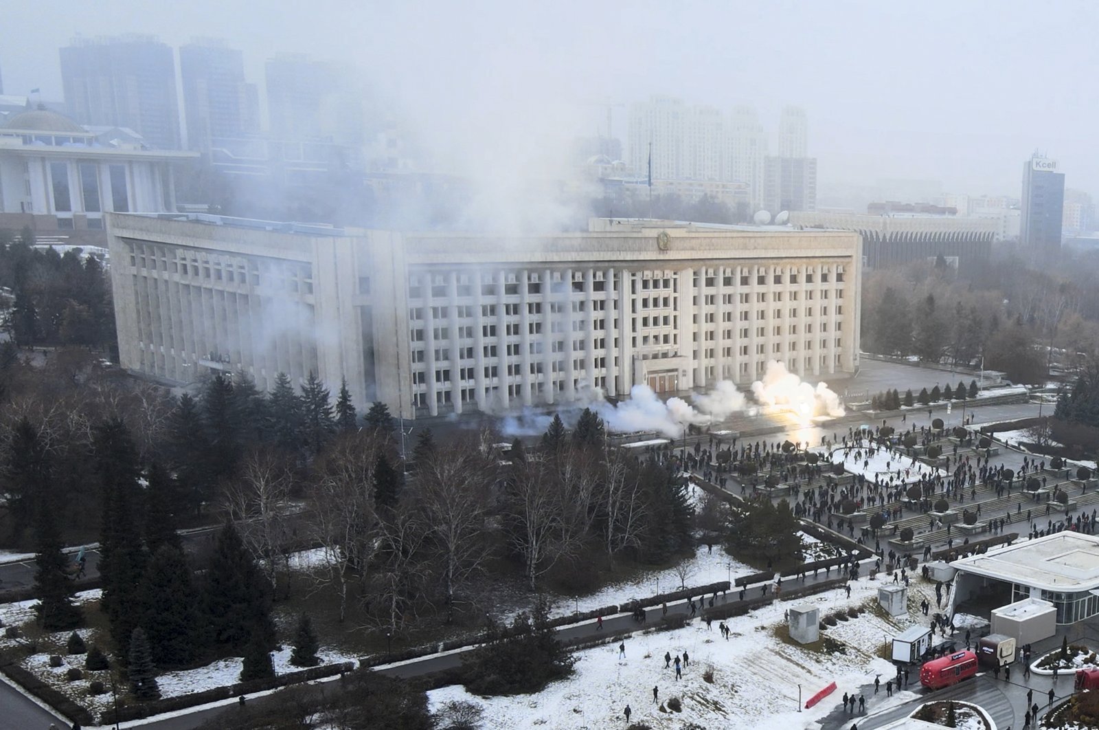 Smoke rises from the city hall building during a protest in Almaty, Kazakhstan, Jan. 5, 2022. (AP Photo)