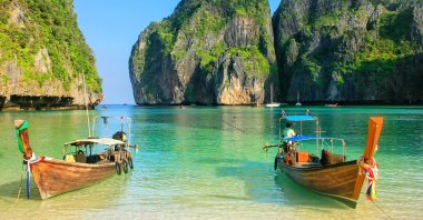 Over-tourism in Maya Bay in Thailand led to massive coral damage after the area was made famous by the 2000 film &quot;The Beach.&quot; (Shutterstock Photo)