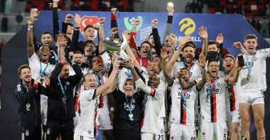 Beşiktaş players and staff celebrate winning the Turkish Super Cup final against Antalyaspor, Doha, Qatar, Jan. 5, 2022. (AA Photo)