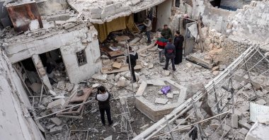 Syrians inspect damage from a reported regime airstrike at a civilian residence in the town of Saraqib in the northwestern Idlib province, Syria, March 10, 2019. (AFP Photo)