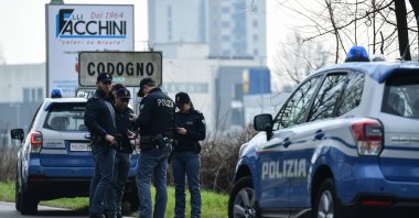 Italian National Police officers patrol at the entrance of a small town under the shadow of a new coronavirus outbreak, Codogno, Italy, Feb. 23, 2020. (AFP Photo)