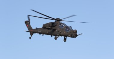 The upgraded version of the T129 Tactical Reconnaissance and Attack Helicopter delivered to Turkey's General Directorate of Security flies over the capital, Ankara, Turkey, May 17, 2021. (IHA Photo)