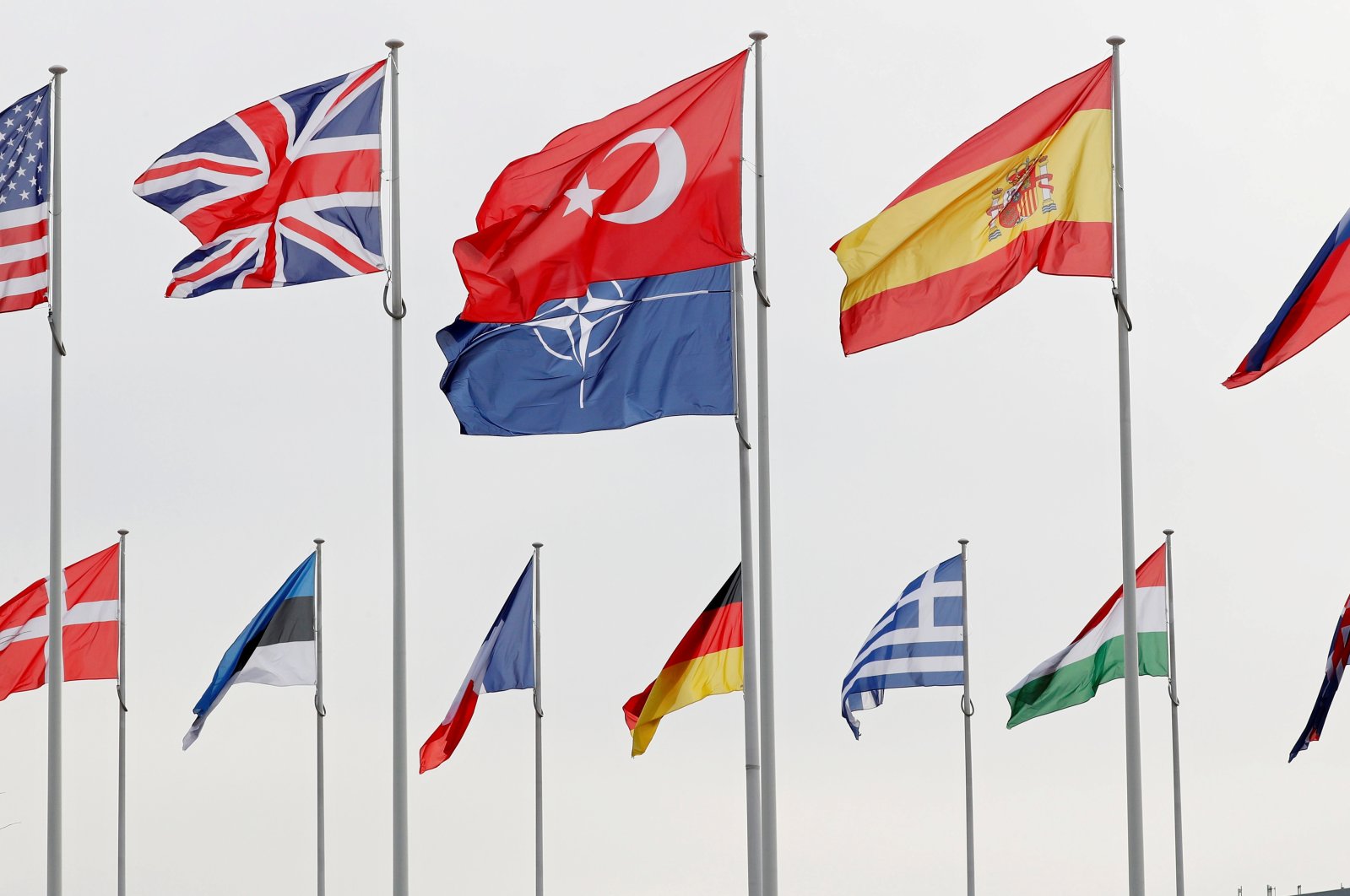 Flags of NATO member countries flutter at the Alliance headquarters in Brussels, Belgium, Feb. 28, 2020.  (Reuters File Photo)