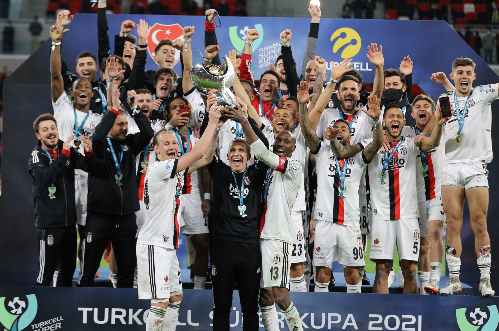 Beşiktaş players and staff celebrate winning the Turkish Super Cup final against Antalyaspor, Doha, Qatar, Jan. 5, 2022. (AA Photo)