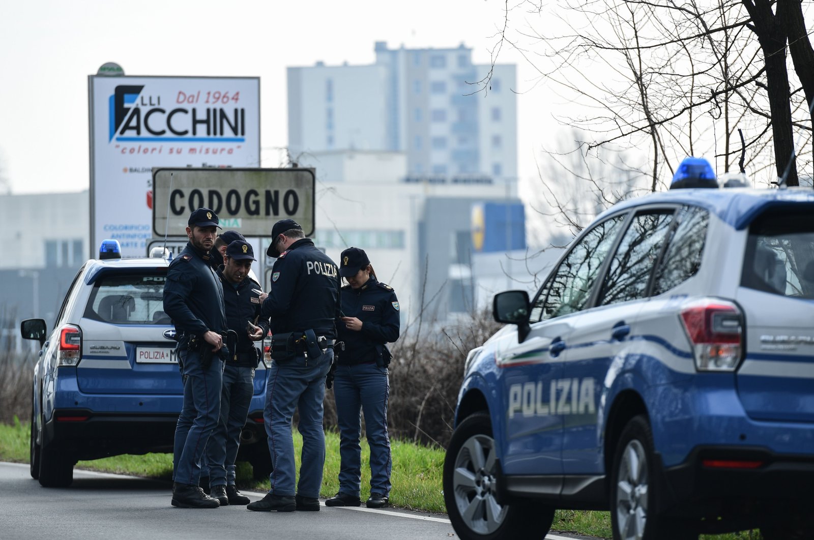 Italian National Police officers patrol at the entrance of a small town under the shadow of a new coronavirus outbreak, Codogno, Italy, Feb. 23, 2020. (AFP Photo)