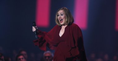 Singer Adele makes her way to the stage to receive the Best British Single award at the Brit Awards 2016 at the 02 Arena in London, England, Feb. 24, 2016. (AP)
