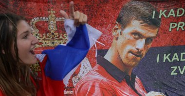 A supporter of Serbian tennis player Novak Djokovic rallies outside the Park Hotel, where the star athlete is believed to be held, Melbourne, Australia, Jan. 7, 2022. (Reuters Photo)