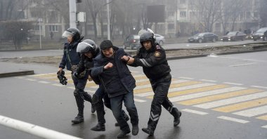 Police officers detain a demonstrator during a protest in Almaty, Kazakhstan, Jan. 5, 2022. (AP Photo)