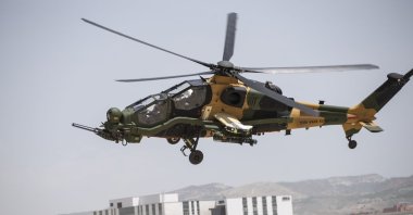 The T129 Tactical Reconnaissance and Attack Helicopter (ATAK) flies over the capital Ankara, Turkey, May 19, 2020. (AA Photo)
