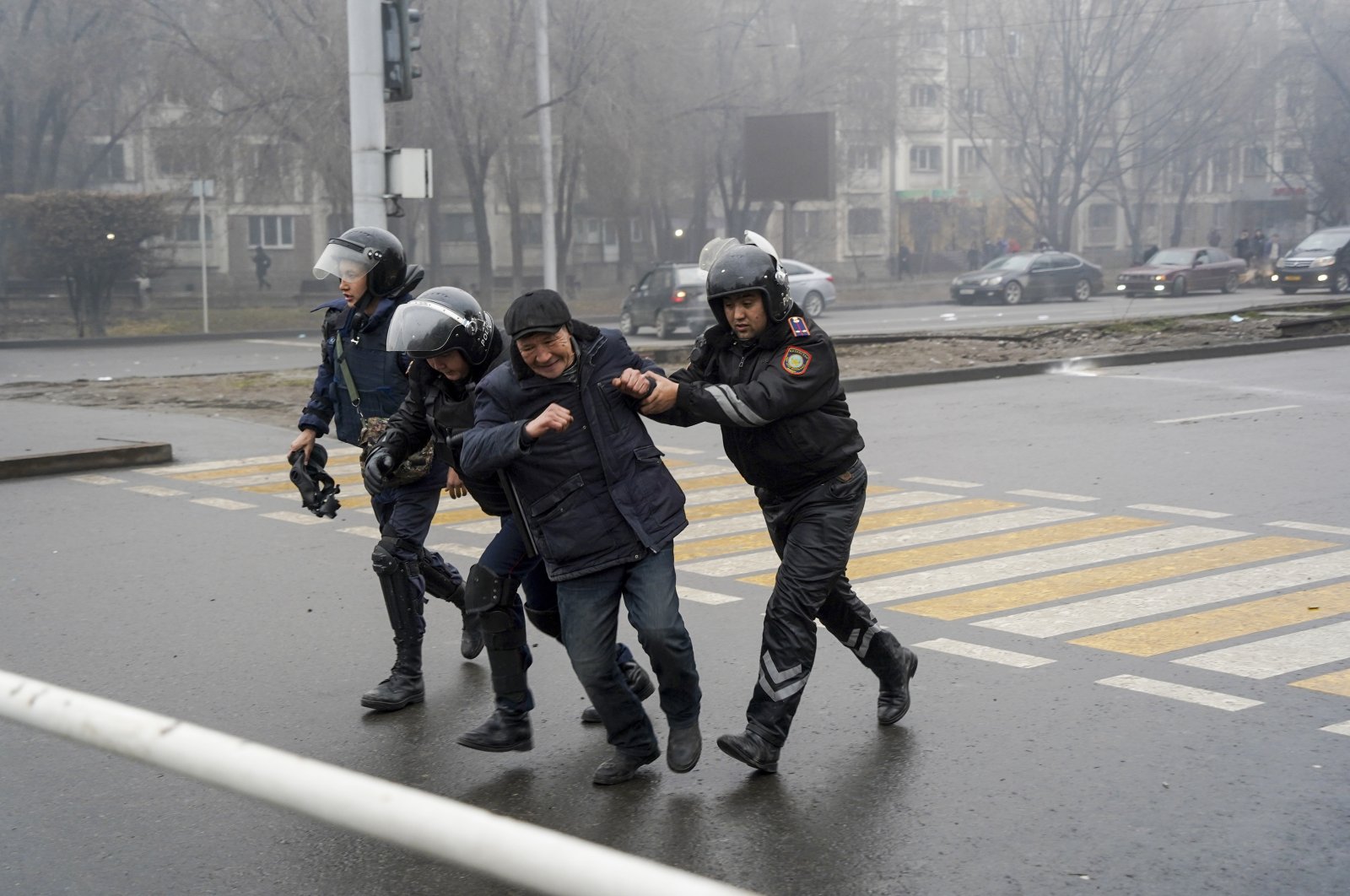 Police officers detain a demonstrator during a protest in Almaty, Kazakhstan, Jan. 5, 2022. (AP Photo)