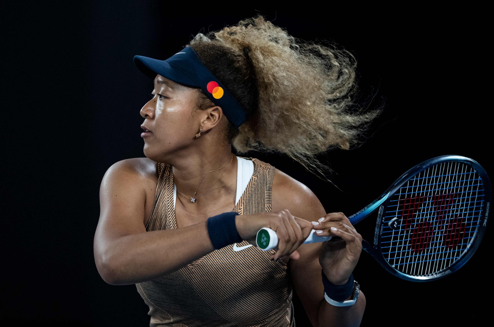 Japan&#039;s Naomi Osaka in action against Germany&#039;s Andrea Petkovic at the Melbourne Summer Set tennis tournament, Melbourne, Australia, Jan. 7, 2022. (AFP Photo)