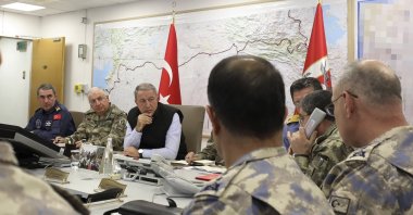 Defense Minister Hulusi Akar (C) with the Turkish army's top commanders in an operation room at the army headquarters, Ankara, Turkey, Oct. 9, 2019. (Defense Ministry Photo)