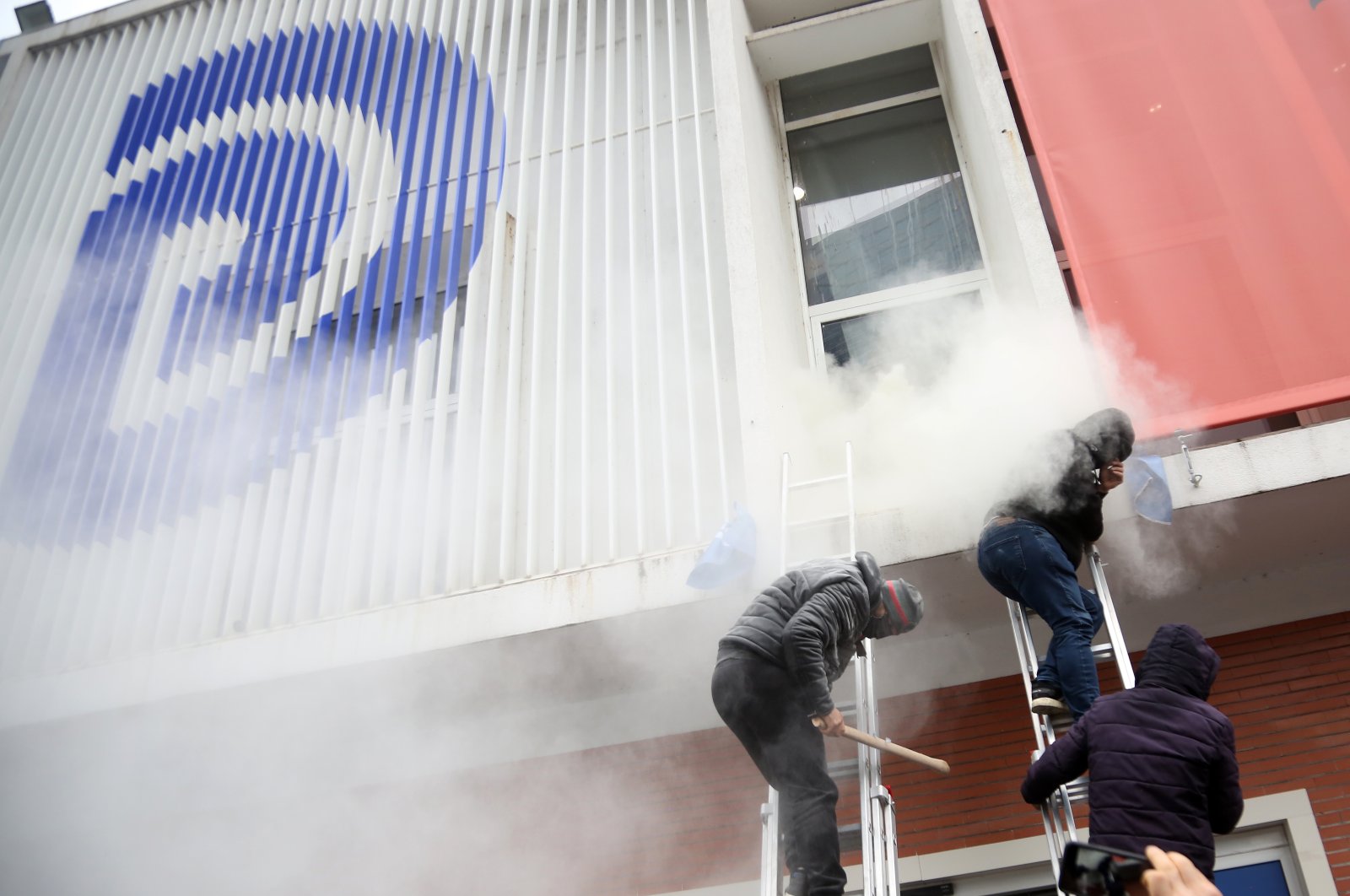Protesters break into the headquarters of the Democratic Party in Tirana, Albania, Jan. 8, 2022. (EPA Photo)