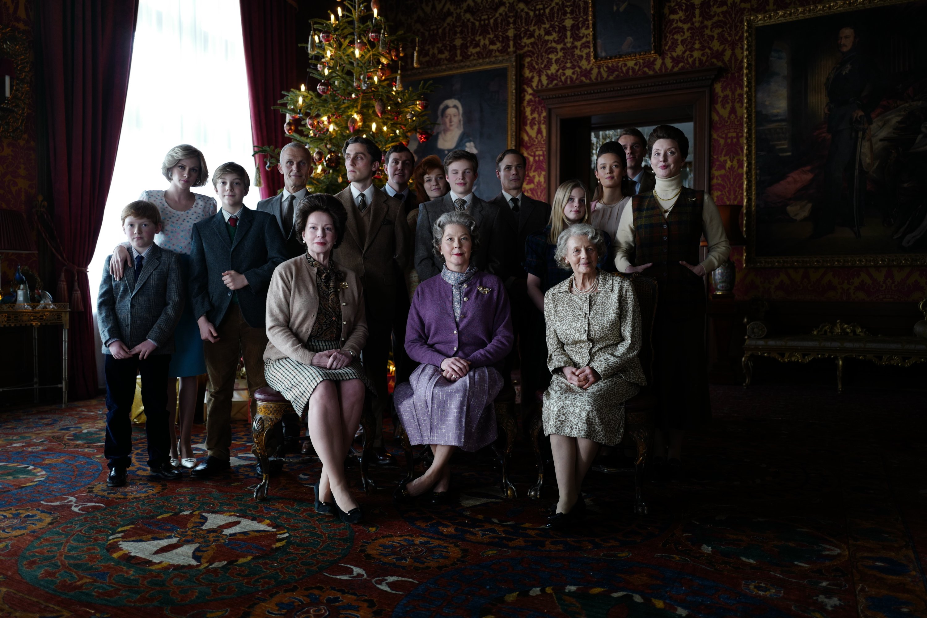 Freddy Spy (L) as Harry, Kristin Stewart (2L) as Diana, Jack Nielen (3L) as William, Jack Farthing (6L) as Charles and Stella Gonet (front M) as the Queen and fellow members of the Royal Family in a scene from the movie 