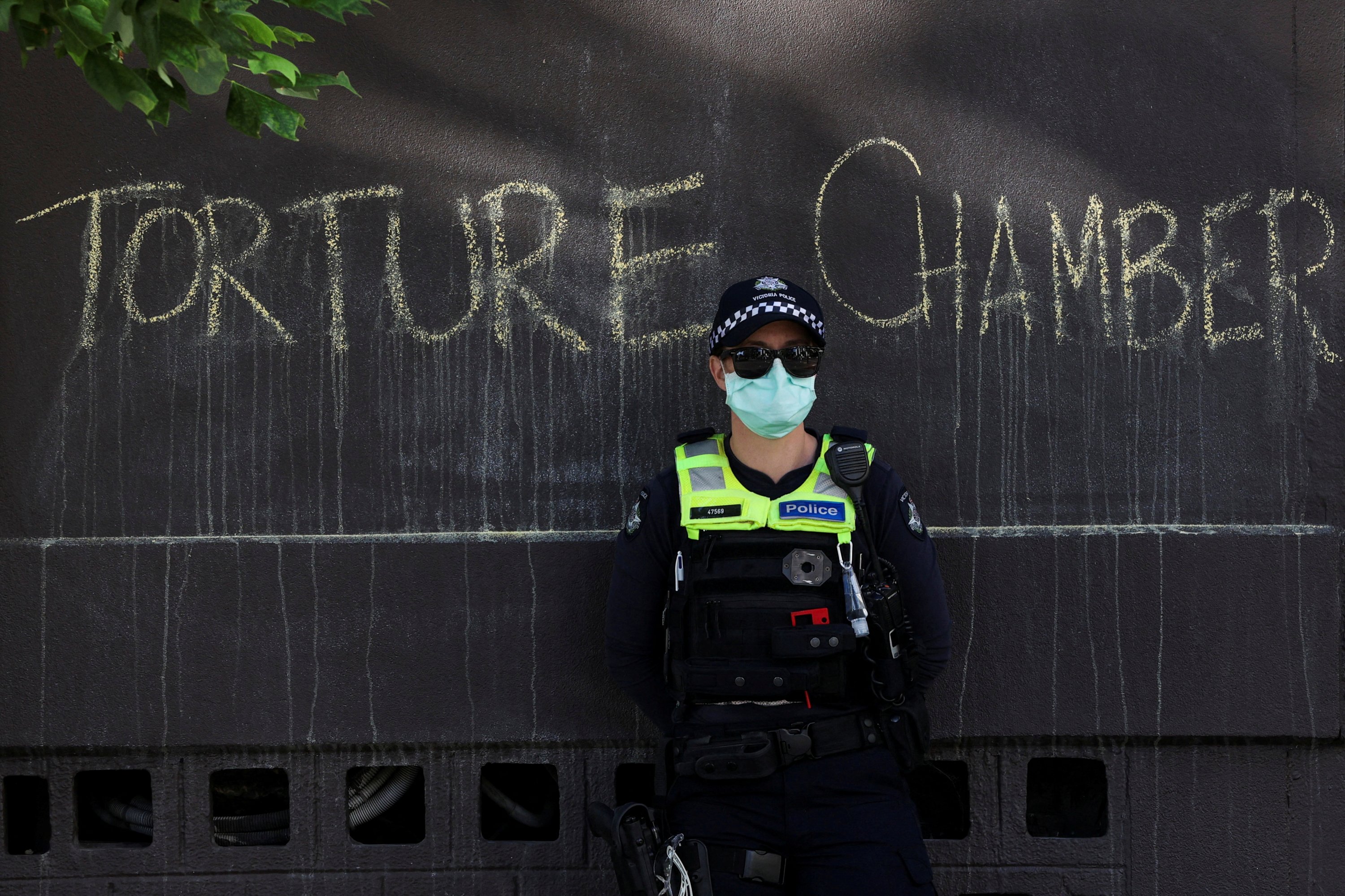 A police officer stands guard following a pro-refugee protest in front of the Park Hotel, Melbourne, Australia, Jan. 9, 2022. (Reuters Photo)