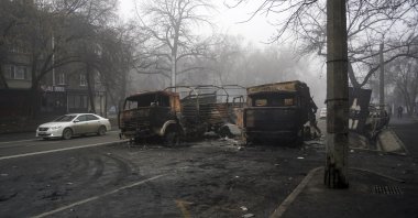 A view of burned military trucks after clashes, on a street in Almaty, Kazakhstan, Jan. 6, 2022. (AP Photo)