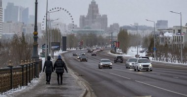 Kazakh people walk down a street in downtown Nur-Sultan, the capital city of Kazakhstan, Jan. 8, 2022. (EPA Photo)