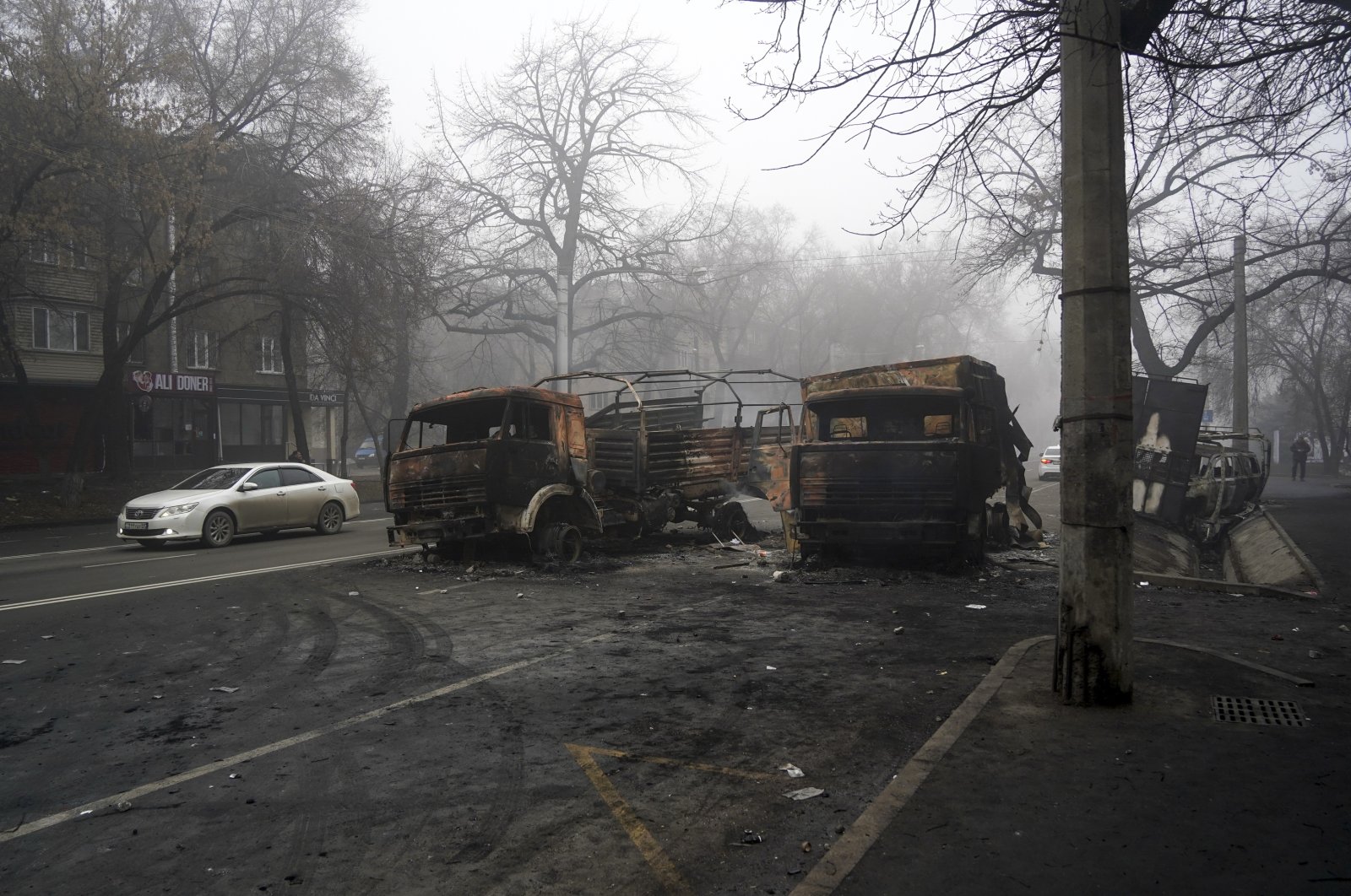 A view of burned military trucks after clashes, on a street in Almaty, Kazakhstan, Jan. 6, 2022. (AP Photo)