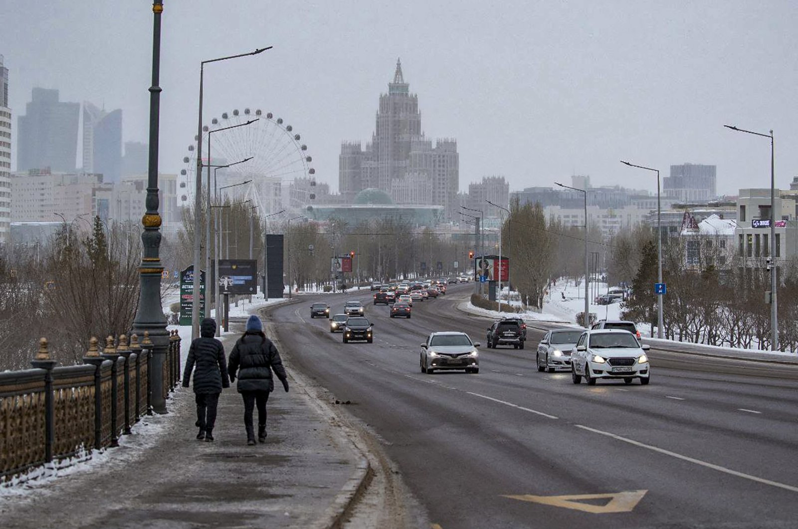 Kazakh people walk down a street in downtown Nur-Sultan, the capital city of Kazakhstan, Jan. 8, 2022. (EPA Photo)