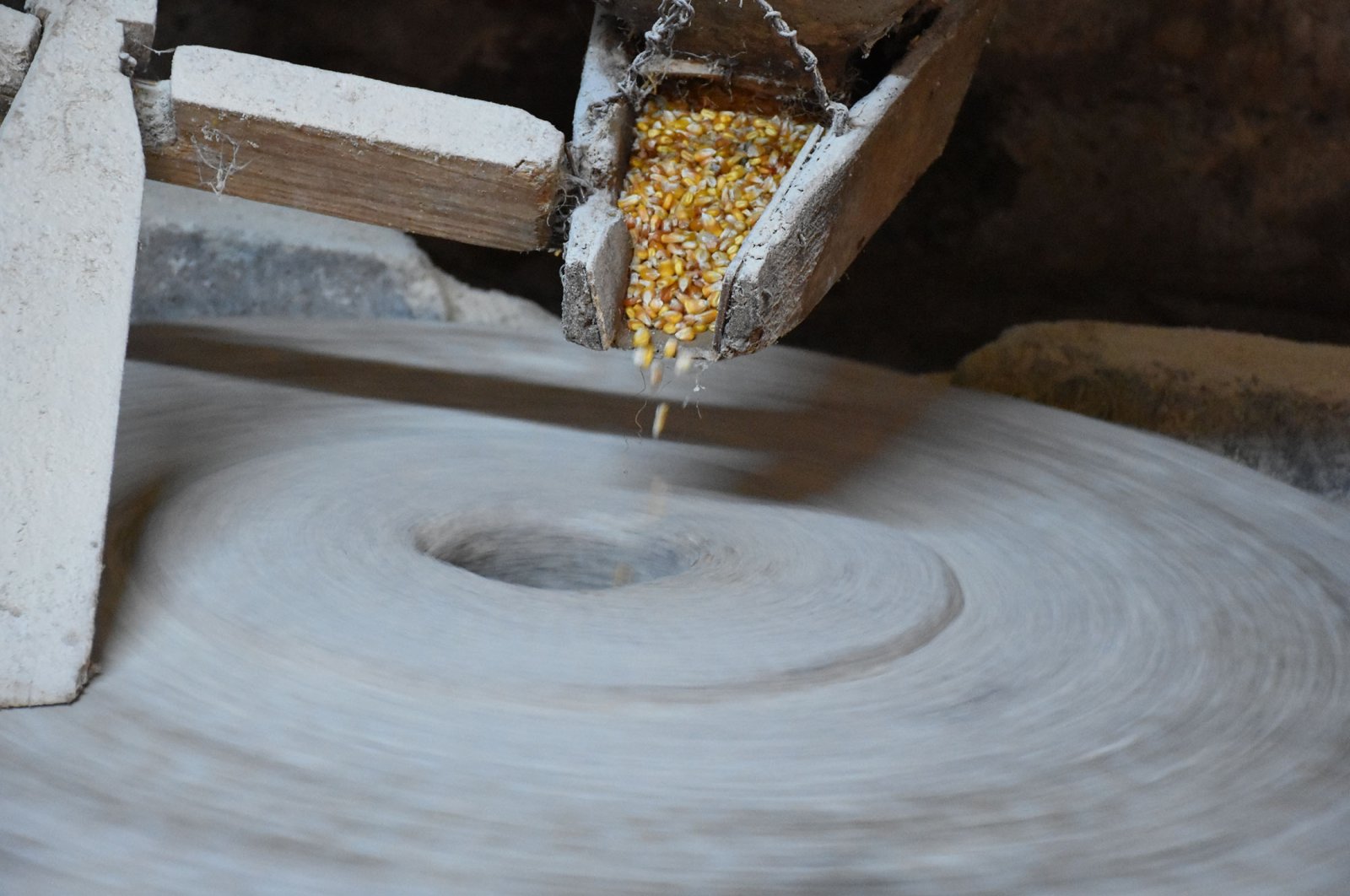 Corn is ground in one of the four stones at Ramadan Sarıdiken&#039;s mill in the Çatalpınar district Ordu, Turkey, Jan. 9, 2022. (AA Photo)