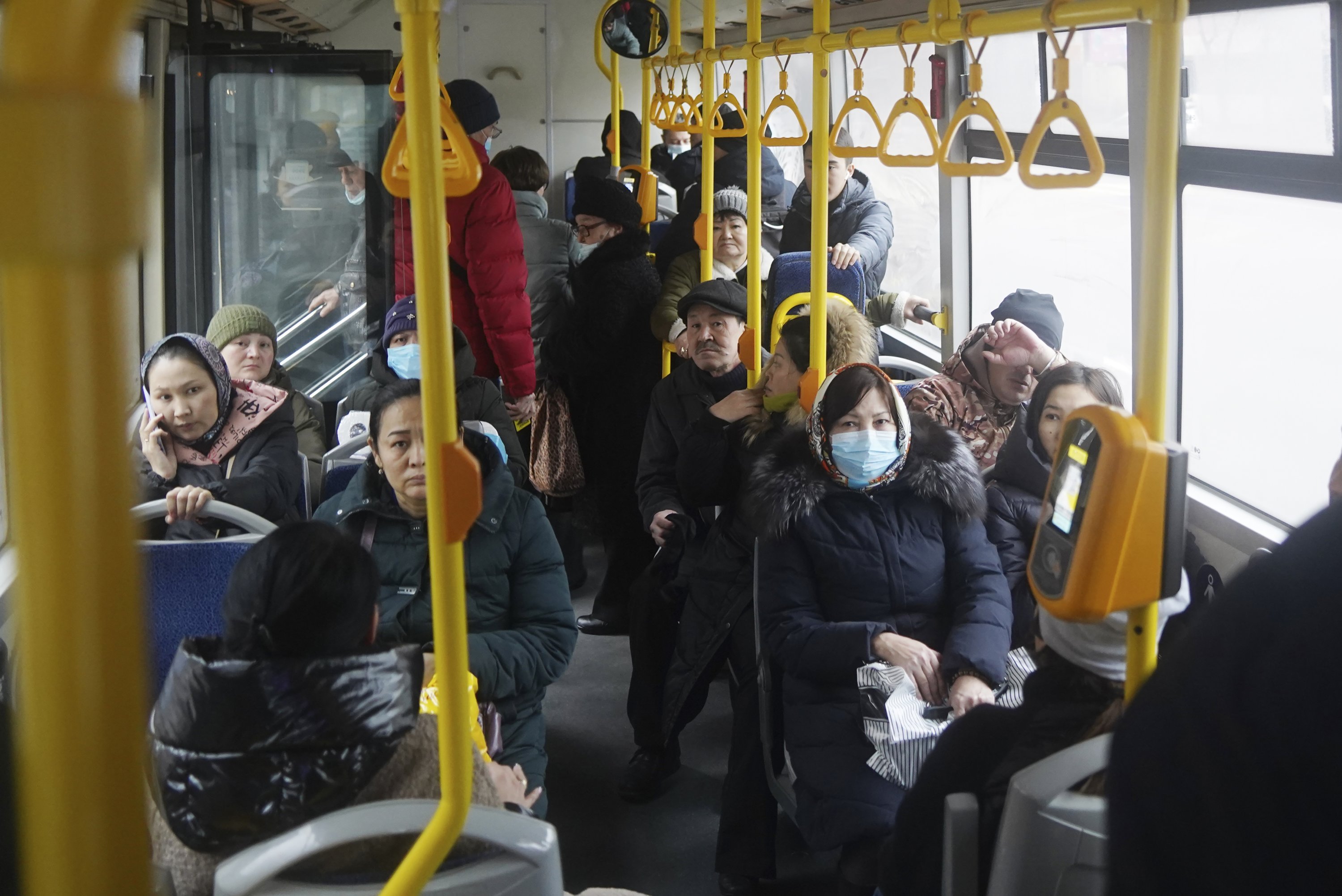 People ride a municipal bus in Almaty, Kazakhstan, Jan. 10, 2022. (AP Photo)