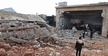 People assess the damage at the al-Arshani water station, after it was reportedly hit by a Russian airstrike, in northwestern Idlib, Syria, Jan. 2, 2022. (AFP Photo)