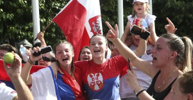 Fans of Serbia's Novak Djokovic react to news of his overturned ruling outside Federal Court ahead of the Australian Open, Melbourne, Australia, Jan. 10, 2022. (AP Photo)