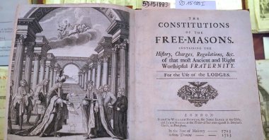A copy of the work &quot;The Constitutions of the Free-Masons,&quot; the first Masonic constitution written by James Anderson published in 1723, on display at the Poznan University Library in Poznan, Poland, Dec. 22, 2021. (AFP Photo)