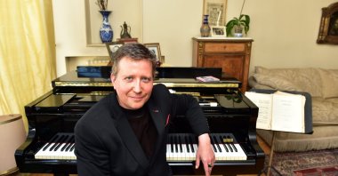 In this Sabah file photo, French pianist Stephane Blet poses in front of his piano, April 5, 2016. (AA) 