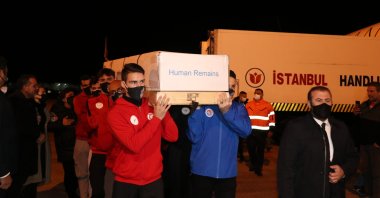 The coffin of Turkish Cypriot mountaineer Birkan Uzun is carried by national athletes at Ercan Airport, TRNC, Jan. 9, 2022. (AA photo)