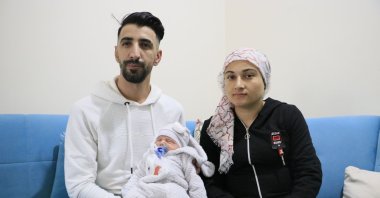 Güven Arslan and his wife Sibel Arslan pose with their newborn baby Ragnar in Diyarbakır, southeastern Turkey, Jan. 10, 2022. (DHA PHOTO)